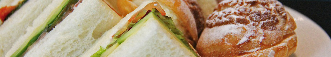 Eating Sandwich at Feldman's Bagels restaurant in Burlington, VT.